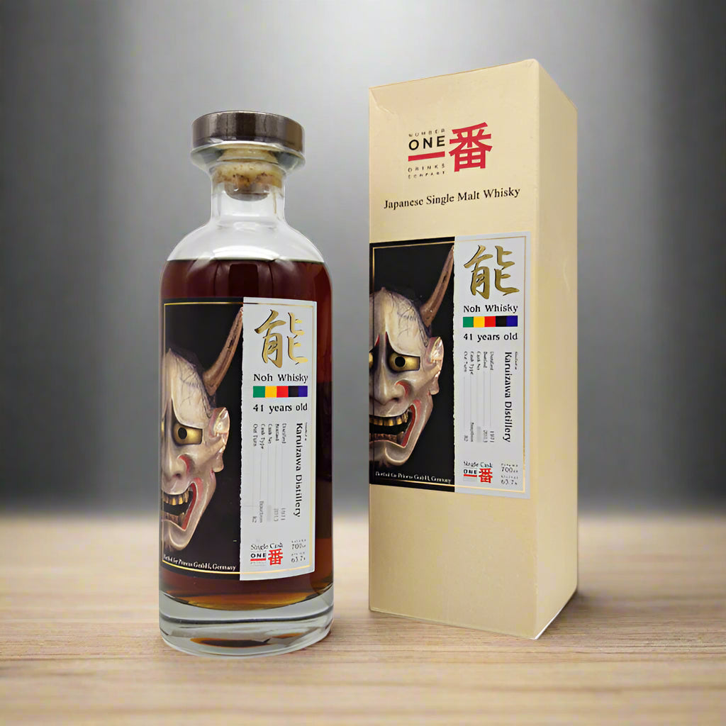Japanese single malt whisky bottle and box with demon face design on a white background